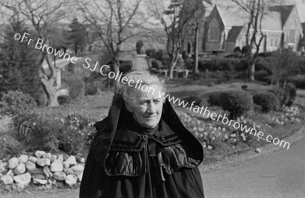 HOODED CLOAK ( MRS O'LEARY ) AT PAROCHIAL HOUSE